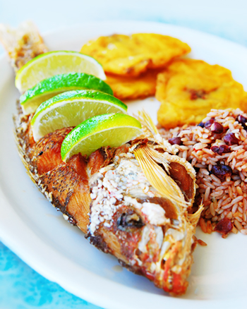 fried red snapper with pinto beans rice and tostones (cuban plantains)